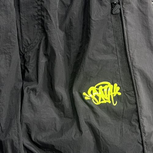Conjunto SYNA WORLD CORTAVIENTO "Negro/Amarillo" + BOLSA Y STICKERS - Imagen 8